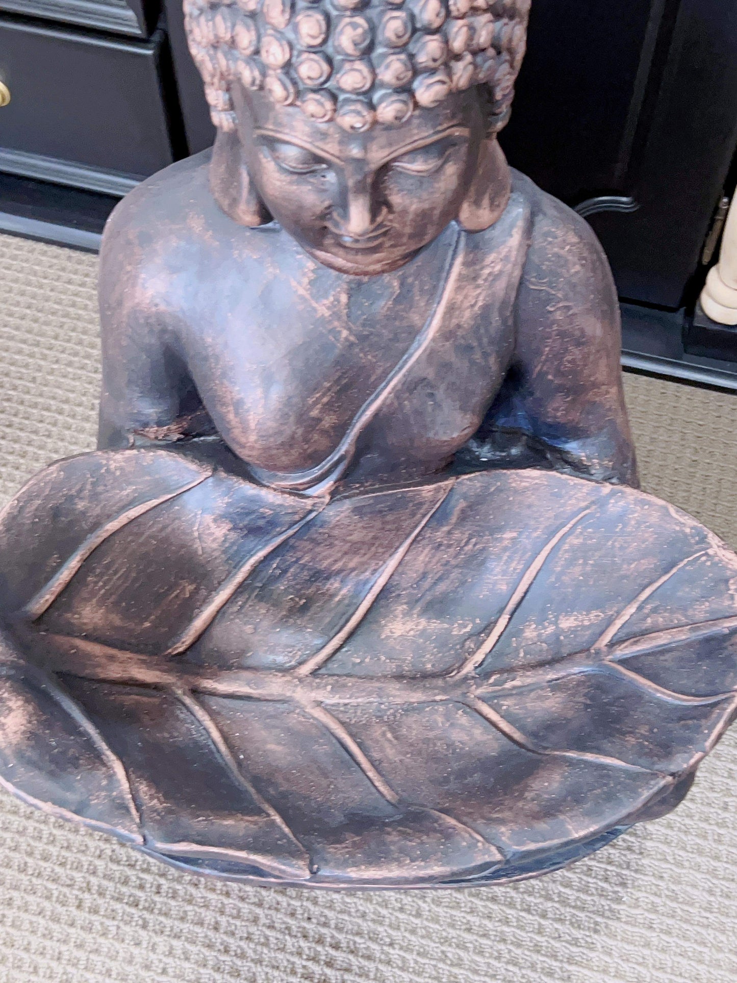 Bronze Buddha Holding Leaf